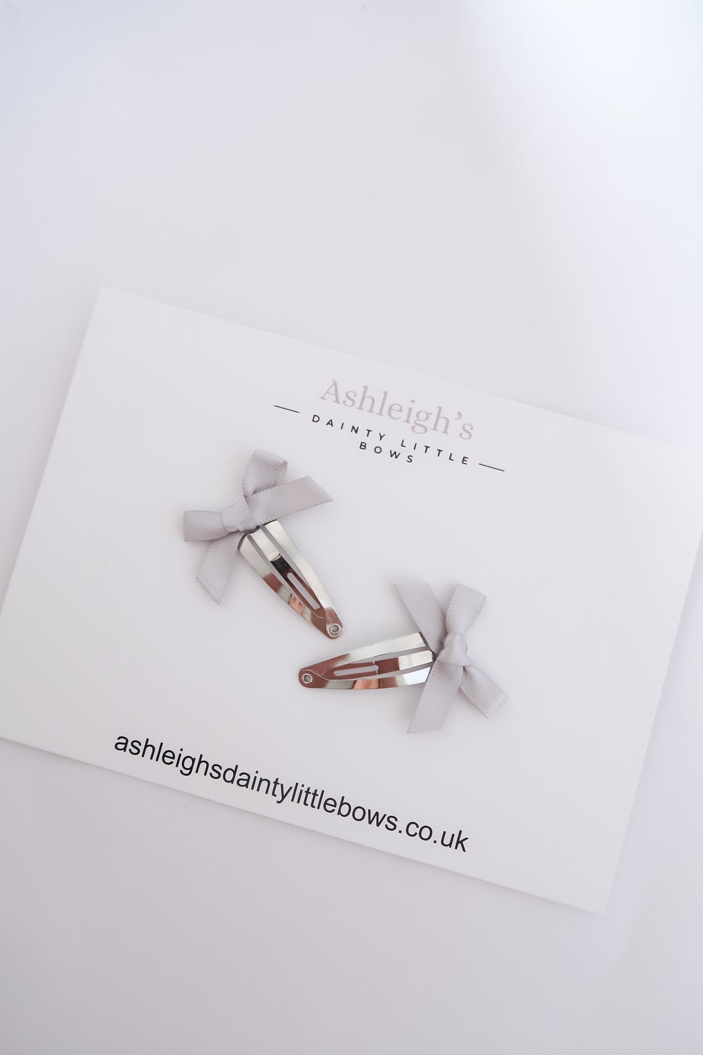 Silver bow snaps