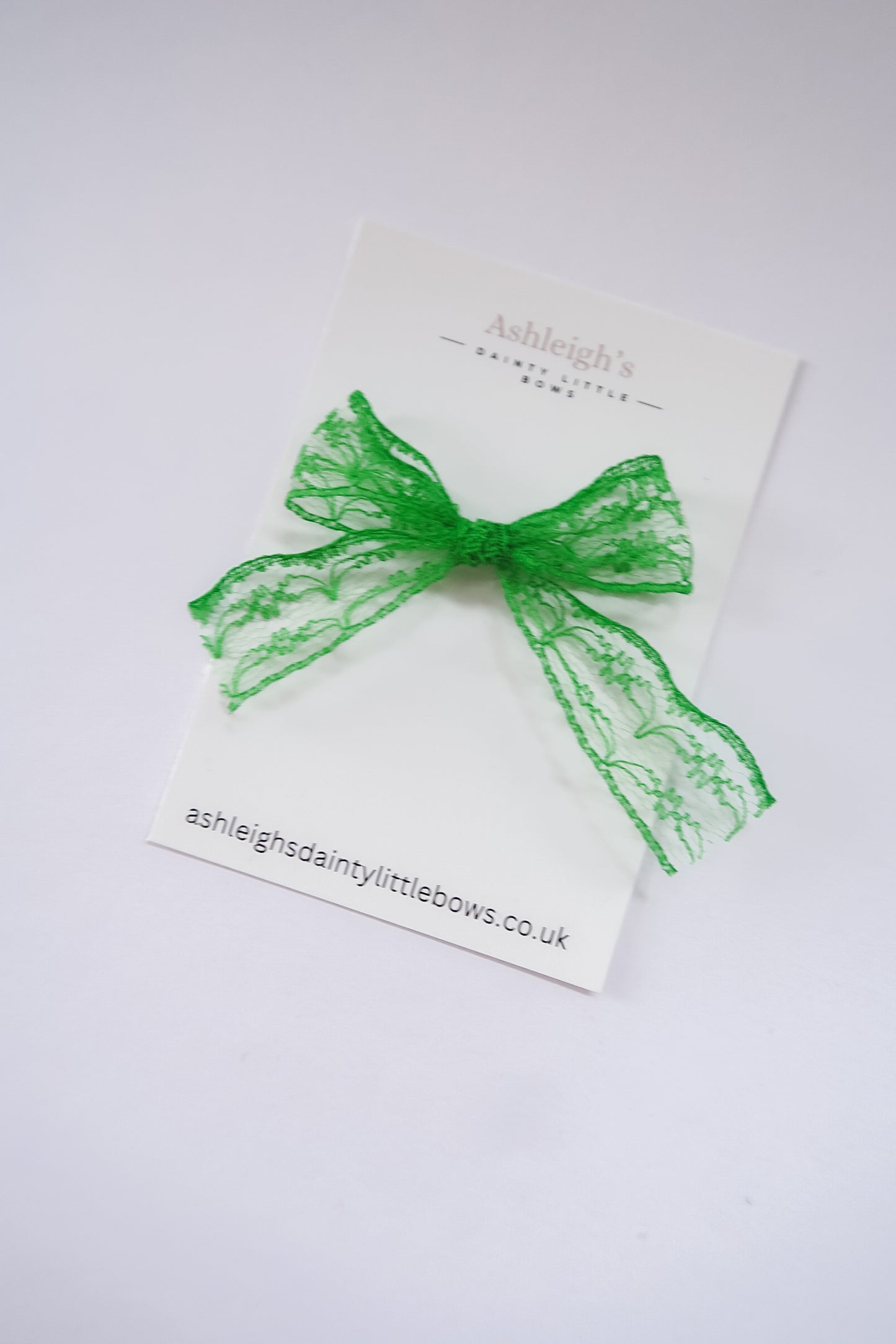 Dainty green lace bow