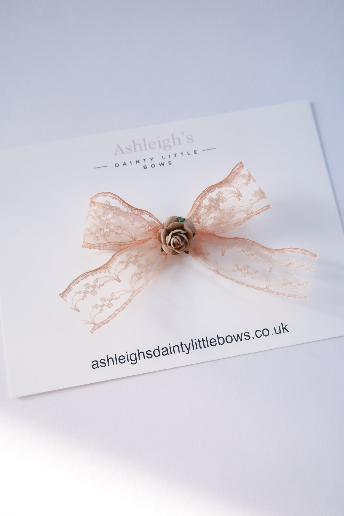 Nude mulberry lace bow