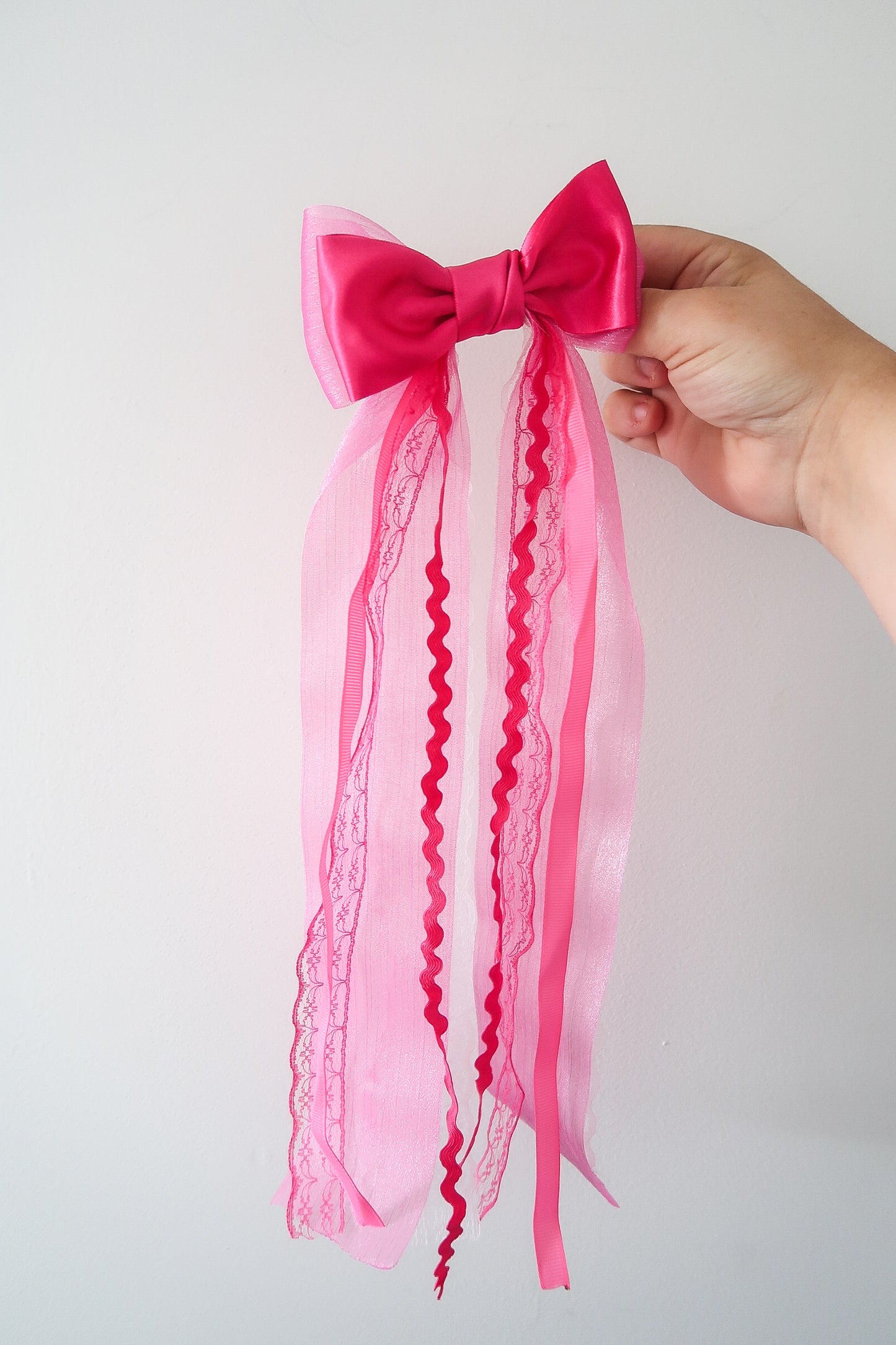 Bright pink messy bow