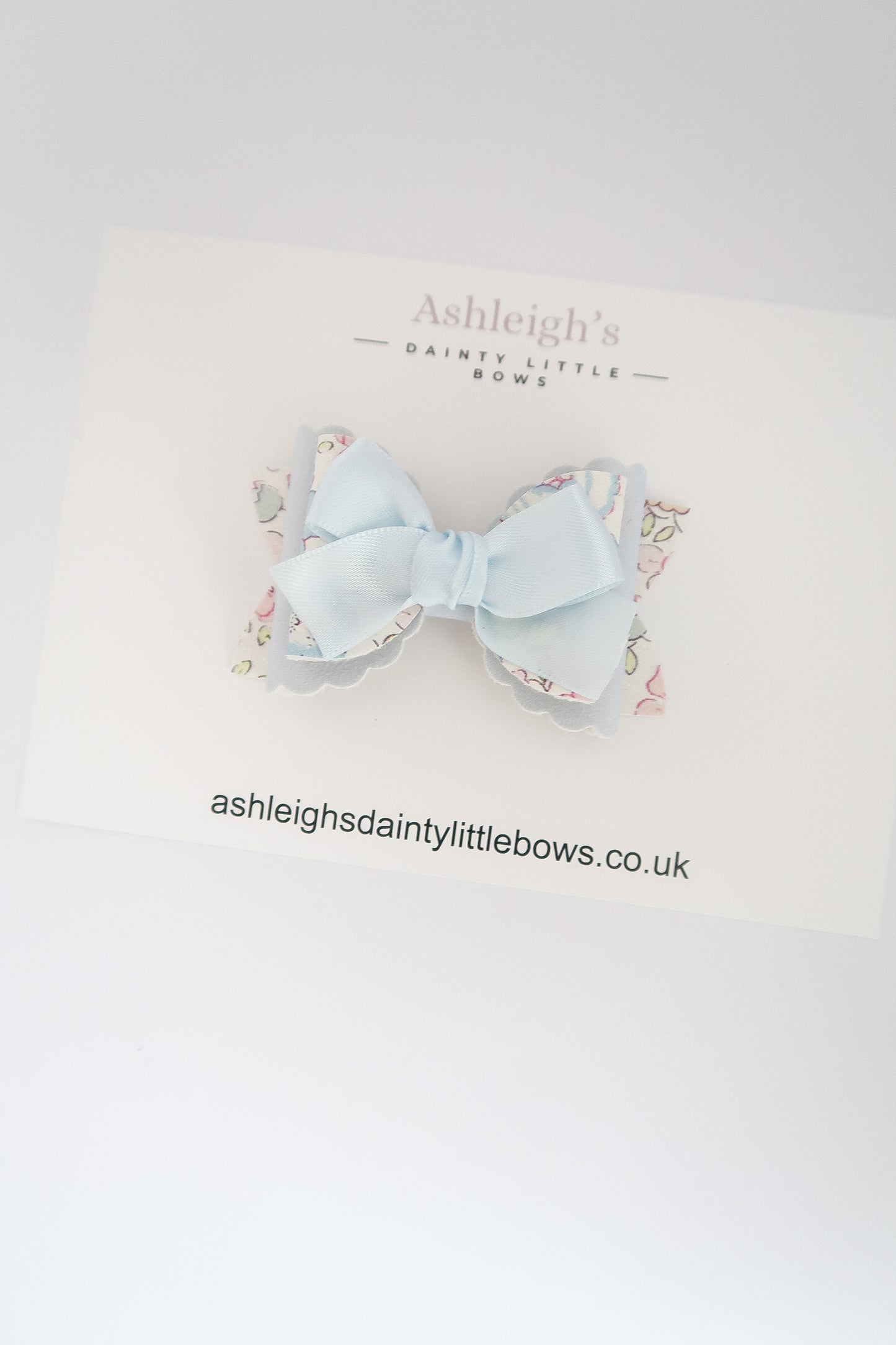 Blue ditsy scalloped bow