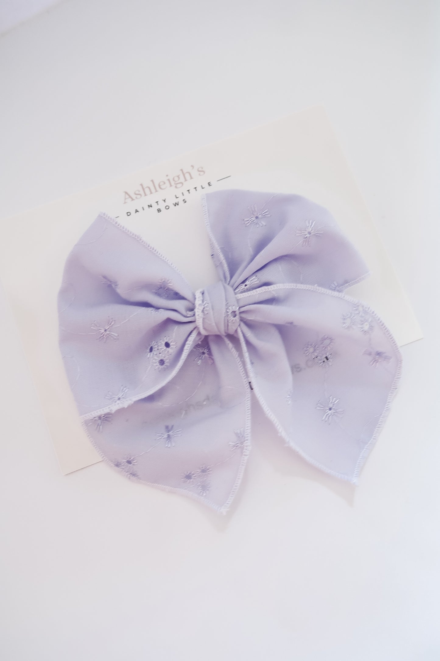 Oversized lilac brodiere fable bow