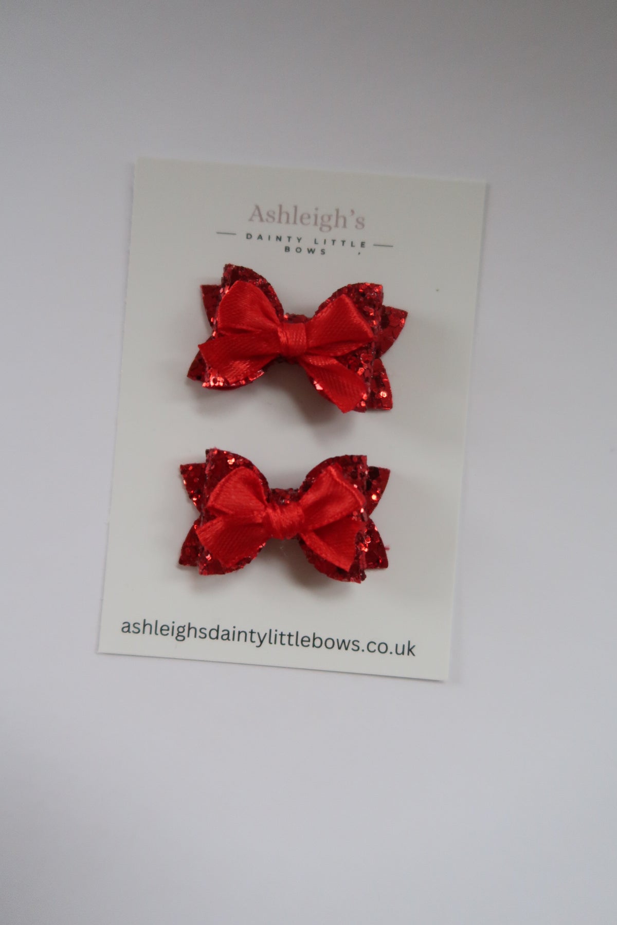 Dainty red baby bow