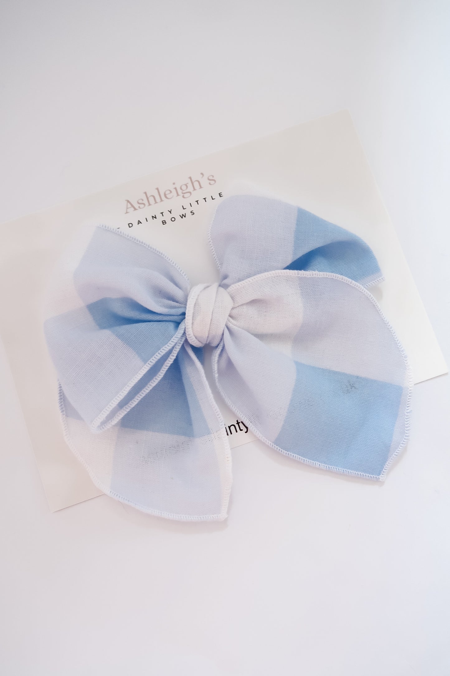 Oversized blue gingham fable bow