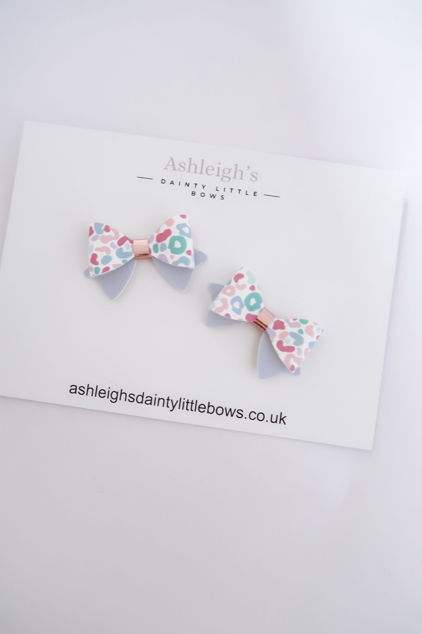 Dainty penny leopard bow