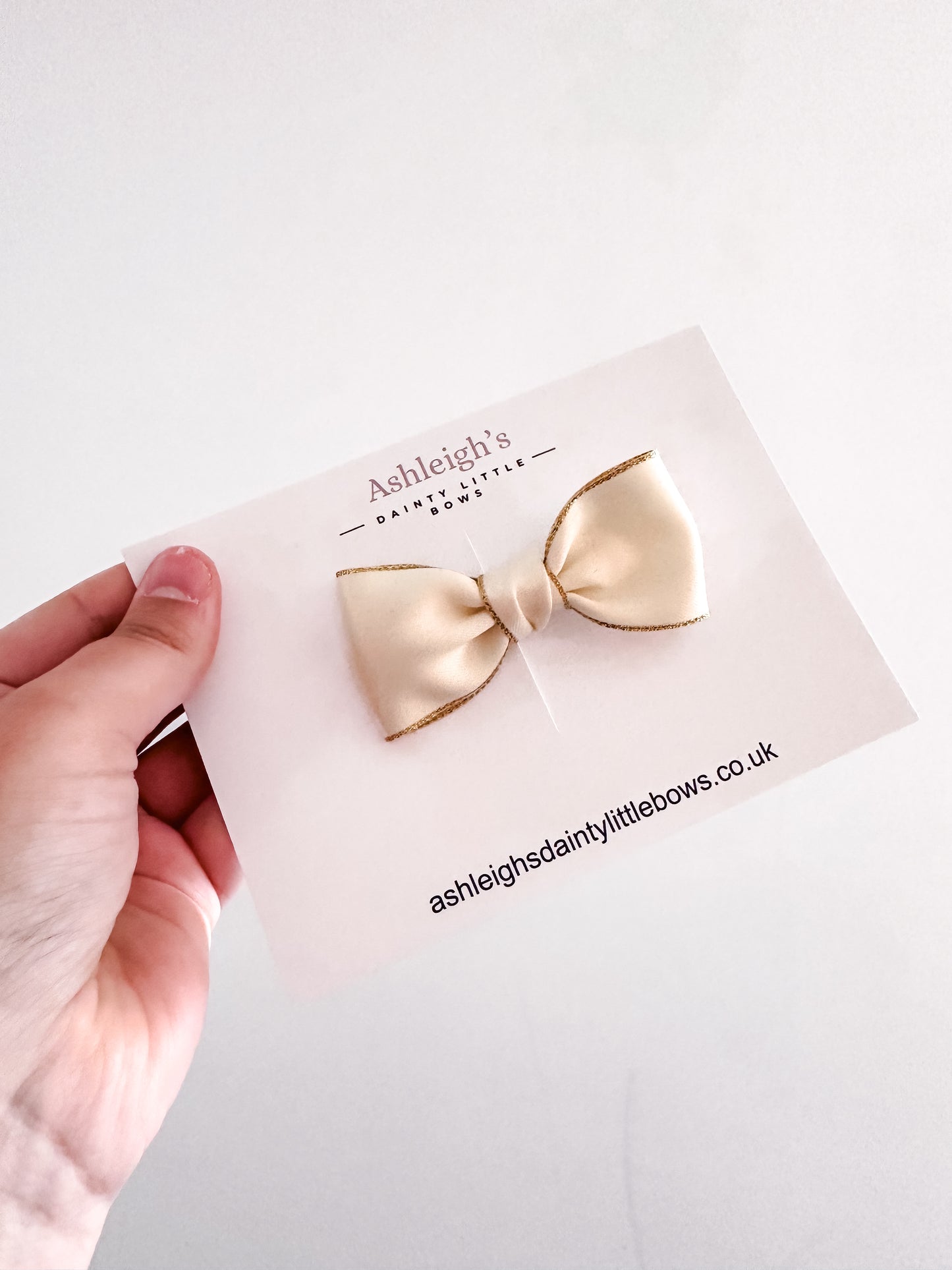 Gold edge twist bow