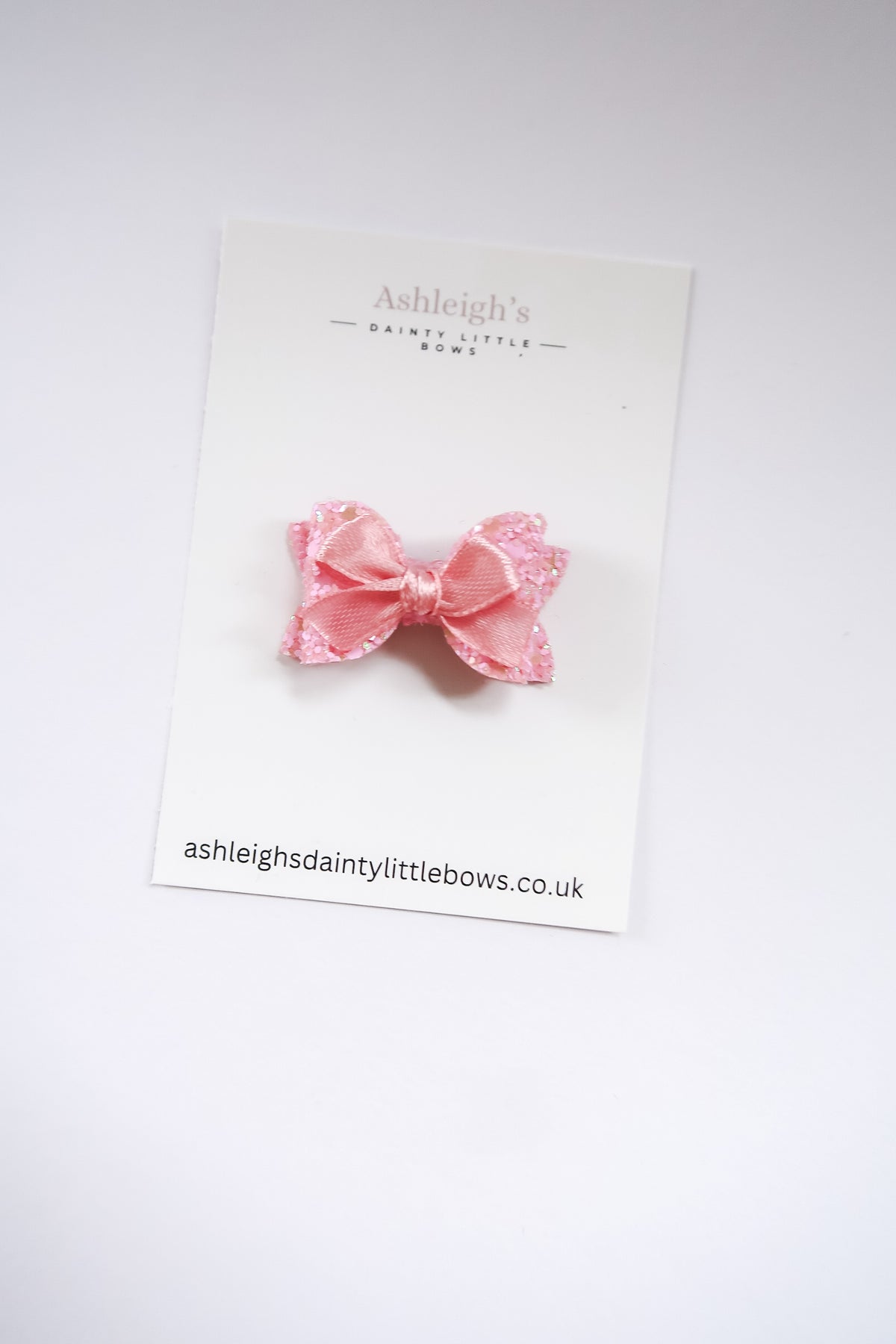Dainty pink baby bow