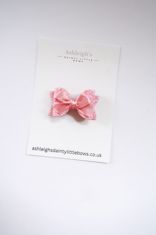 Dainty pink baby bow