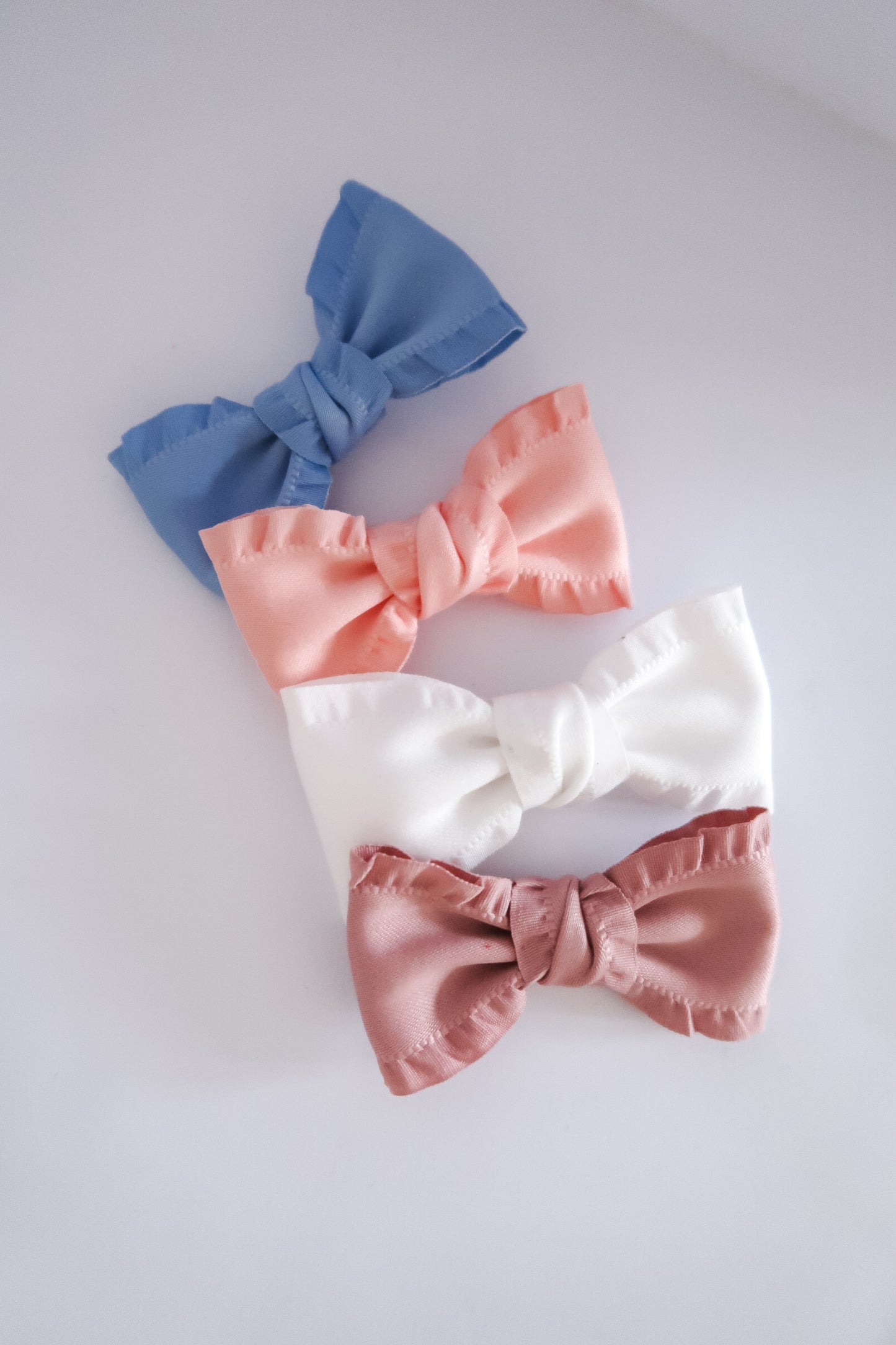 Frilly satin pinch bow
