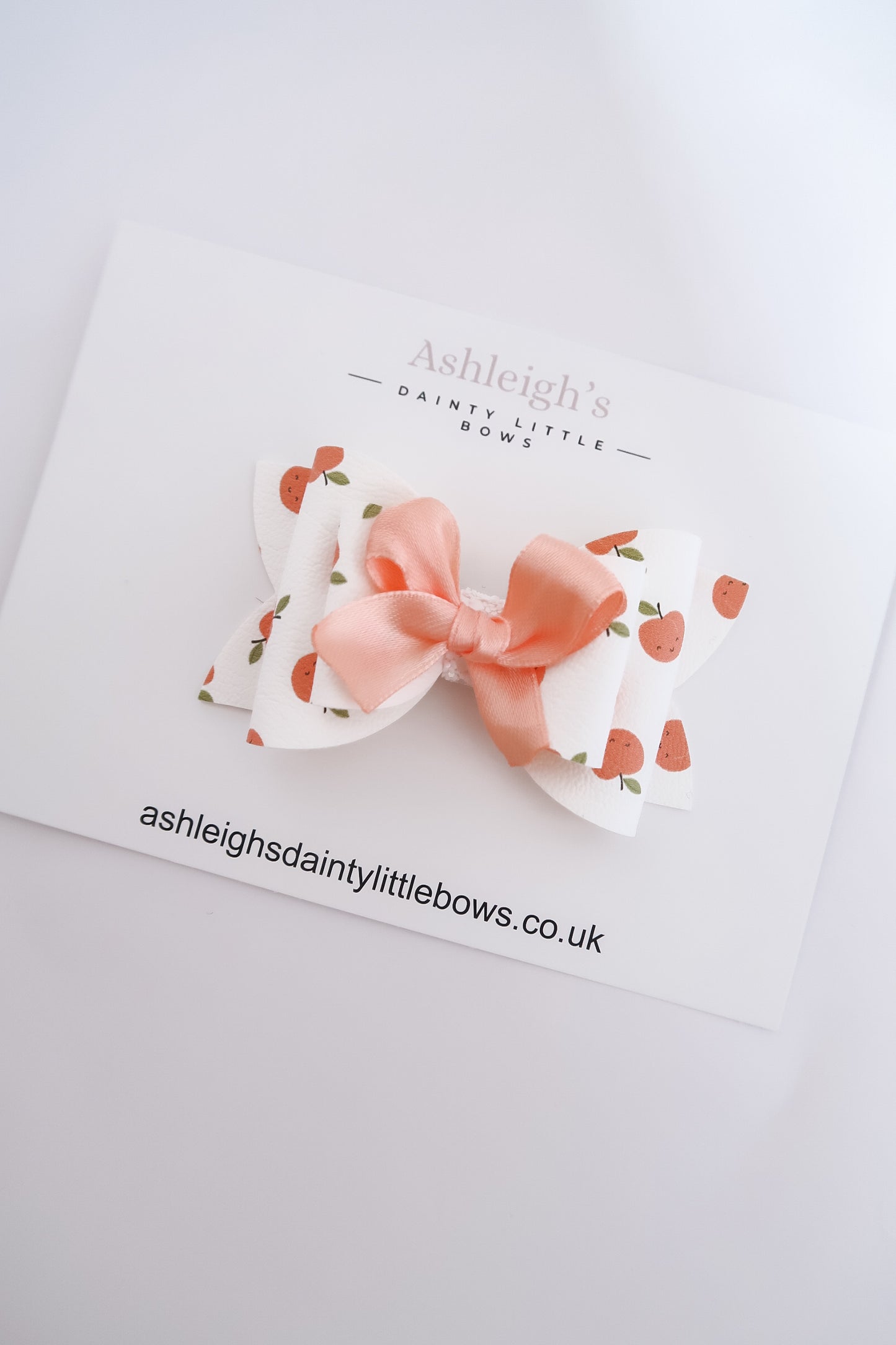 Peach scalloped bow