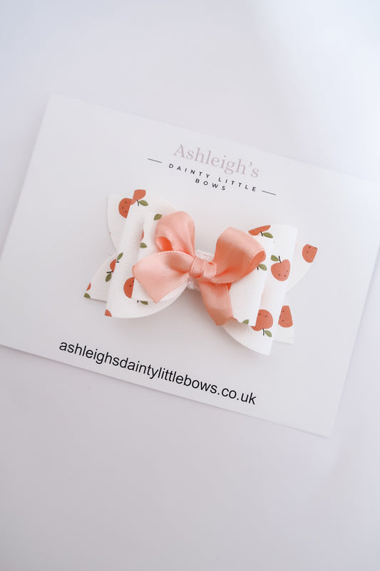 Peach scalloped bow
