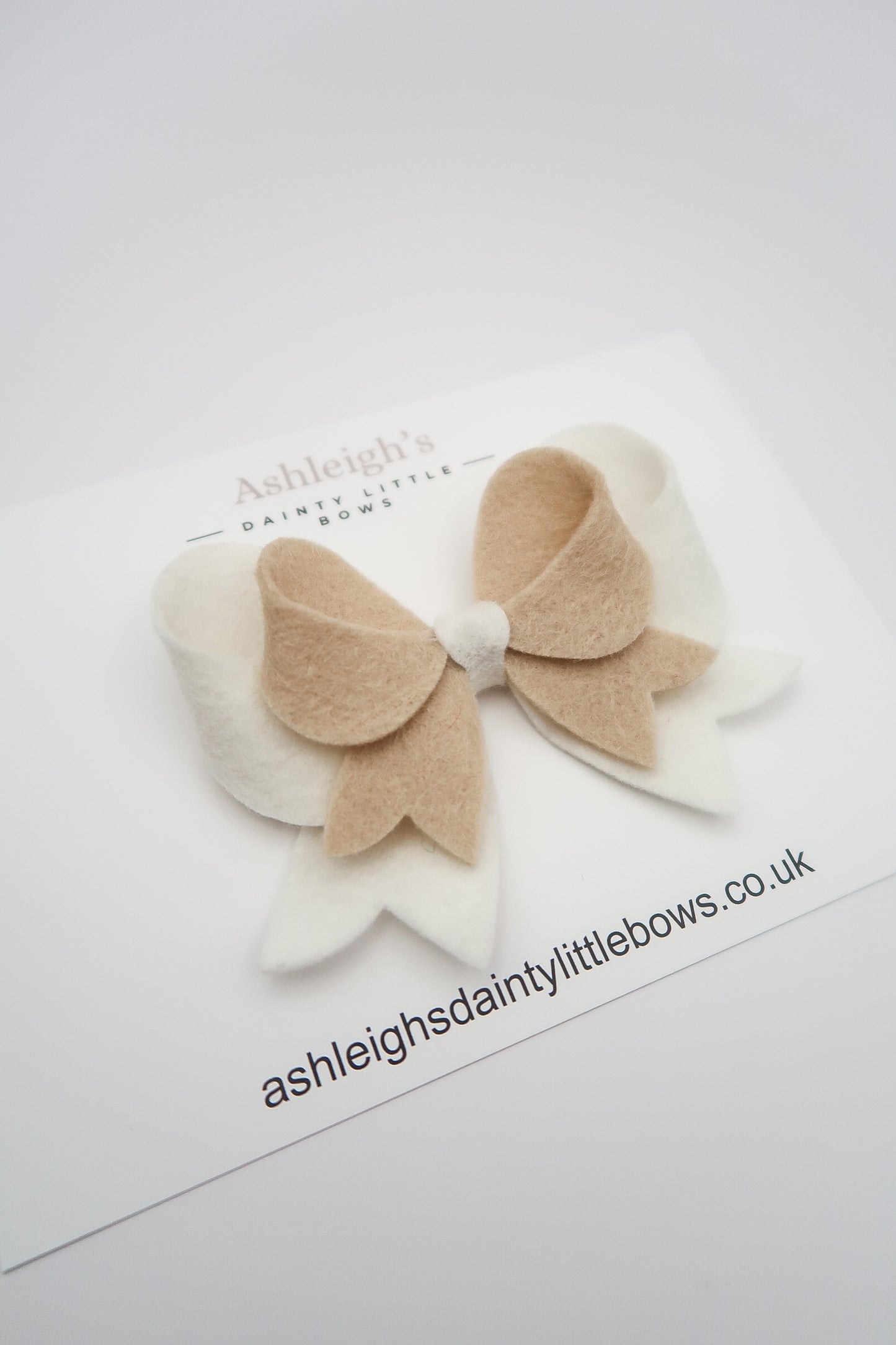 Nude/white combo bow