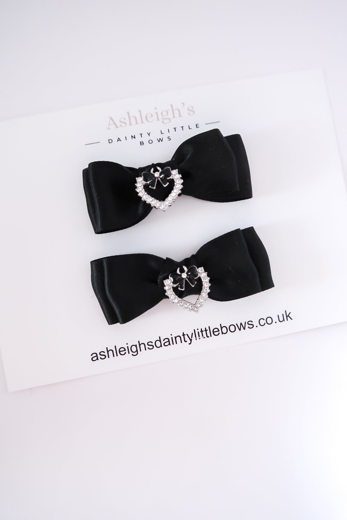 Black heart charm bow