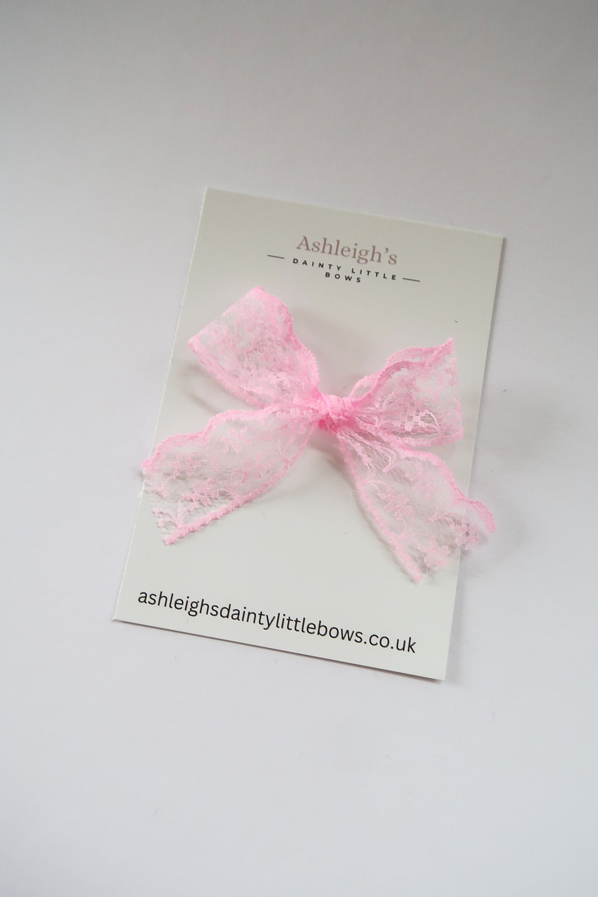 Dainty pink lace bow