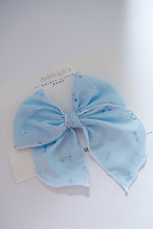 Oversized blue brodiere fable bow