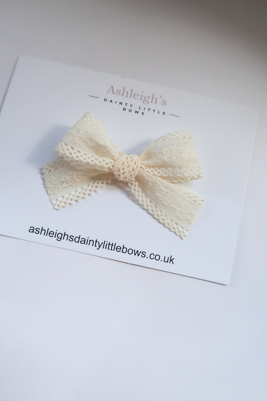 Cream lace tied bow
