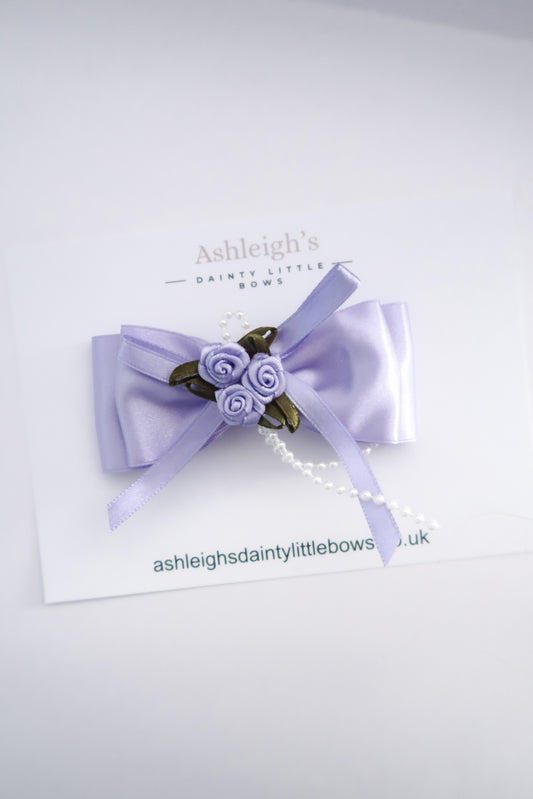 Lilac rose bud bow