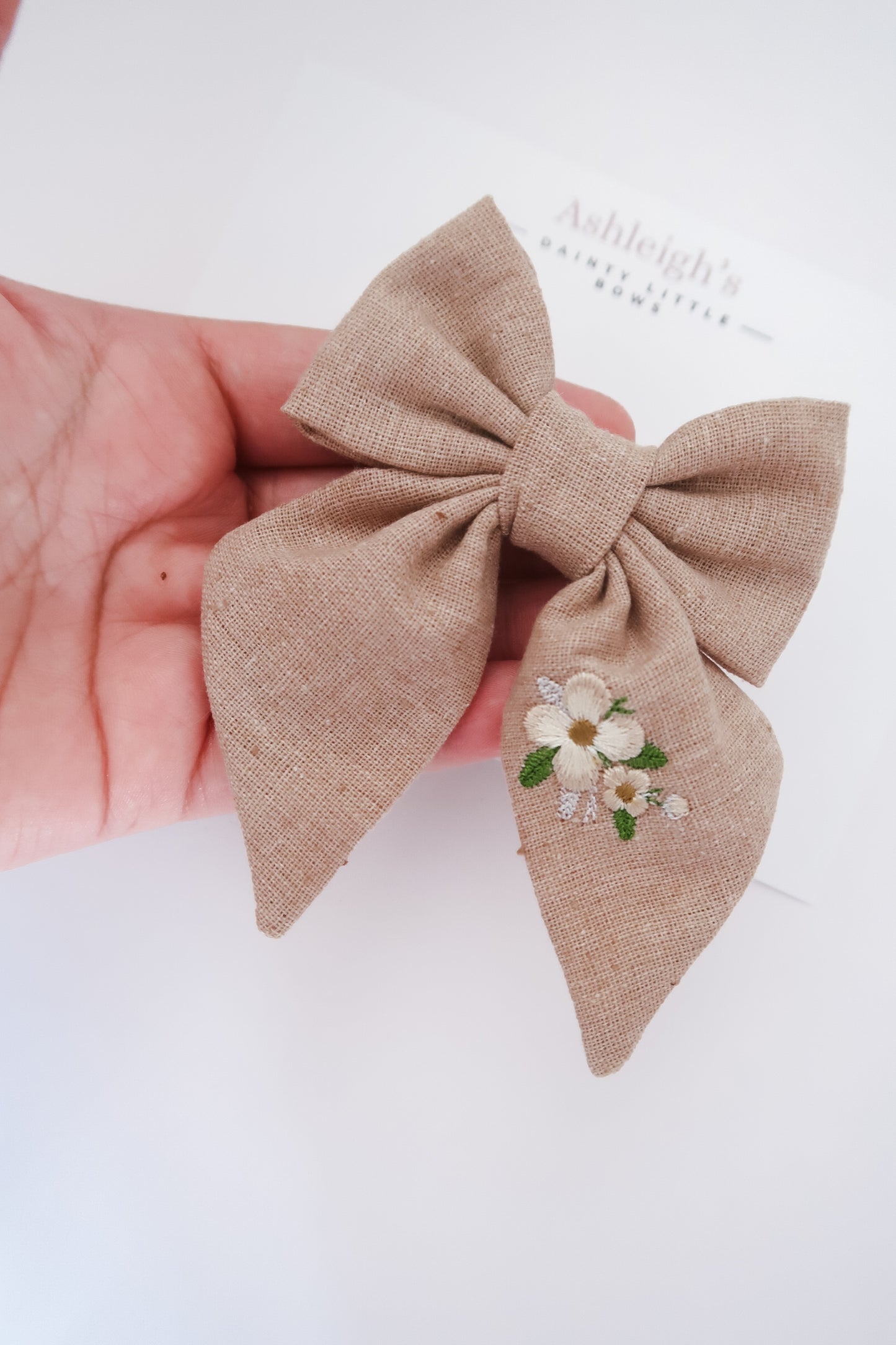 Embroidered linen bow