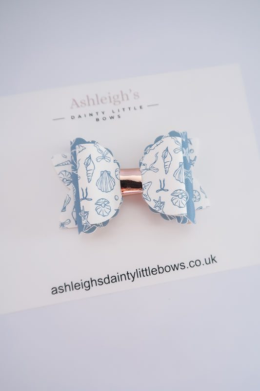 Blue costal scalloped bow