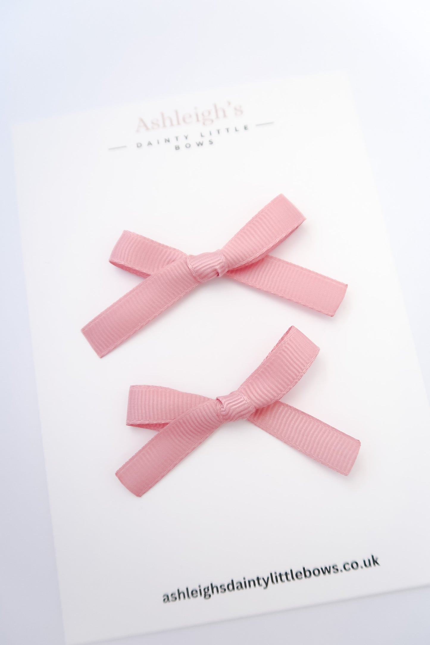 Teeny tiny dusky pink bow