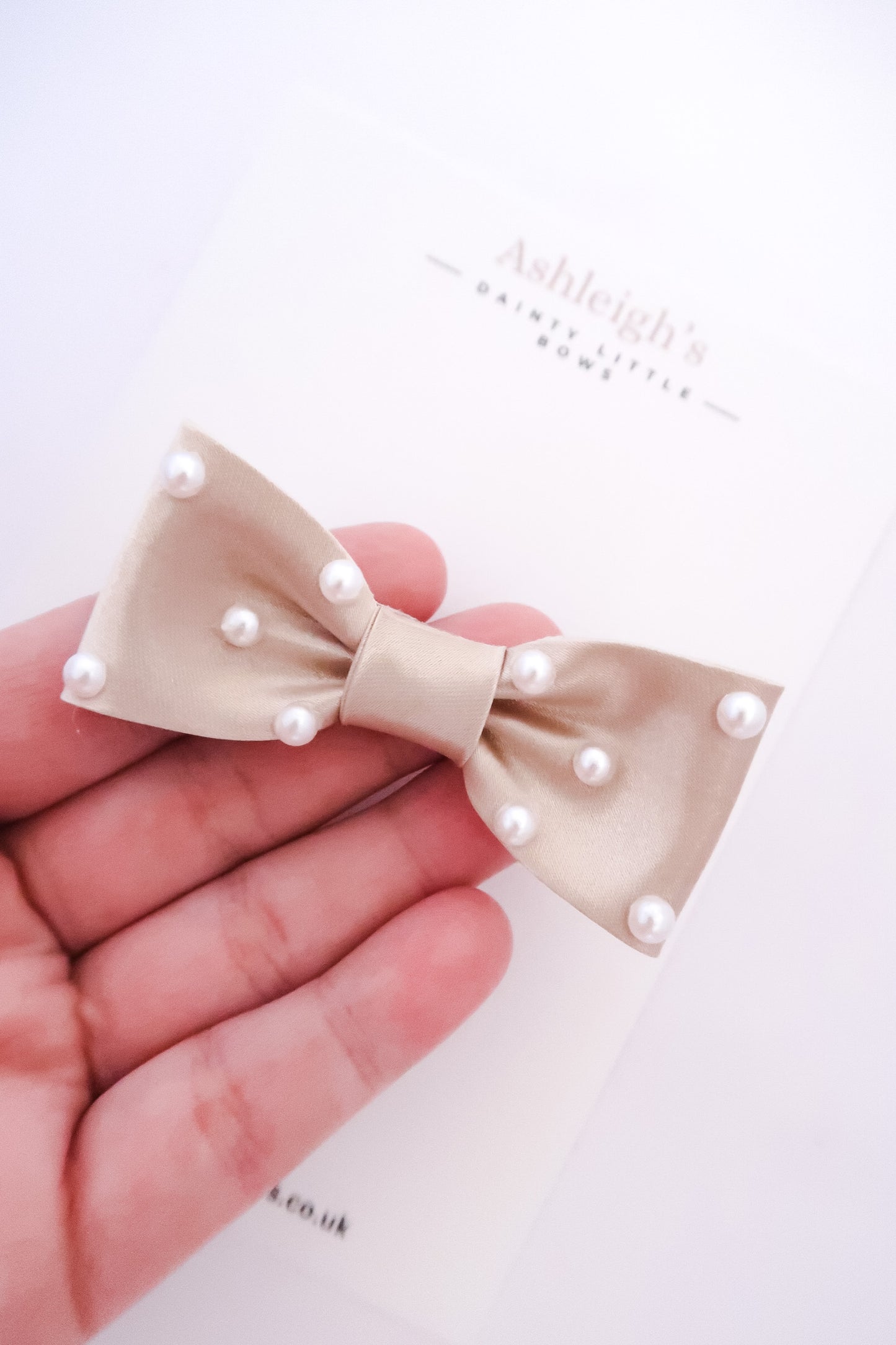 Pearly champagne bow