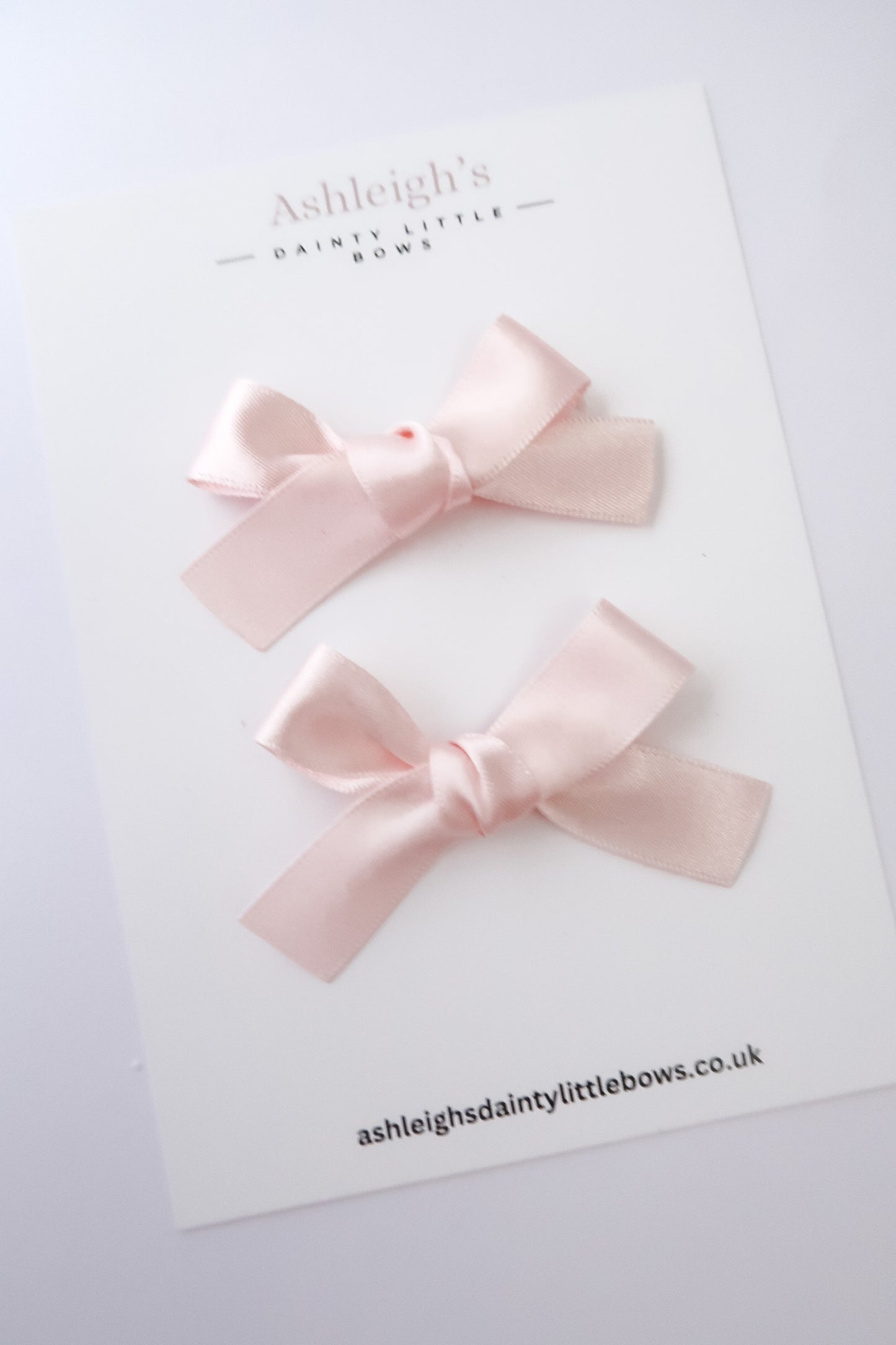 Pink satin handtied mini bows