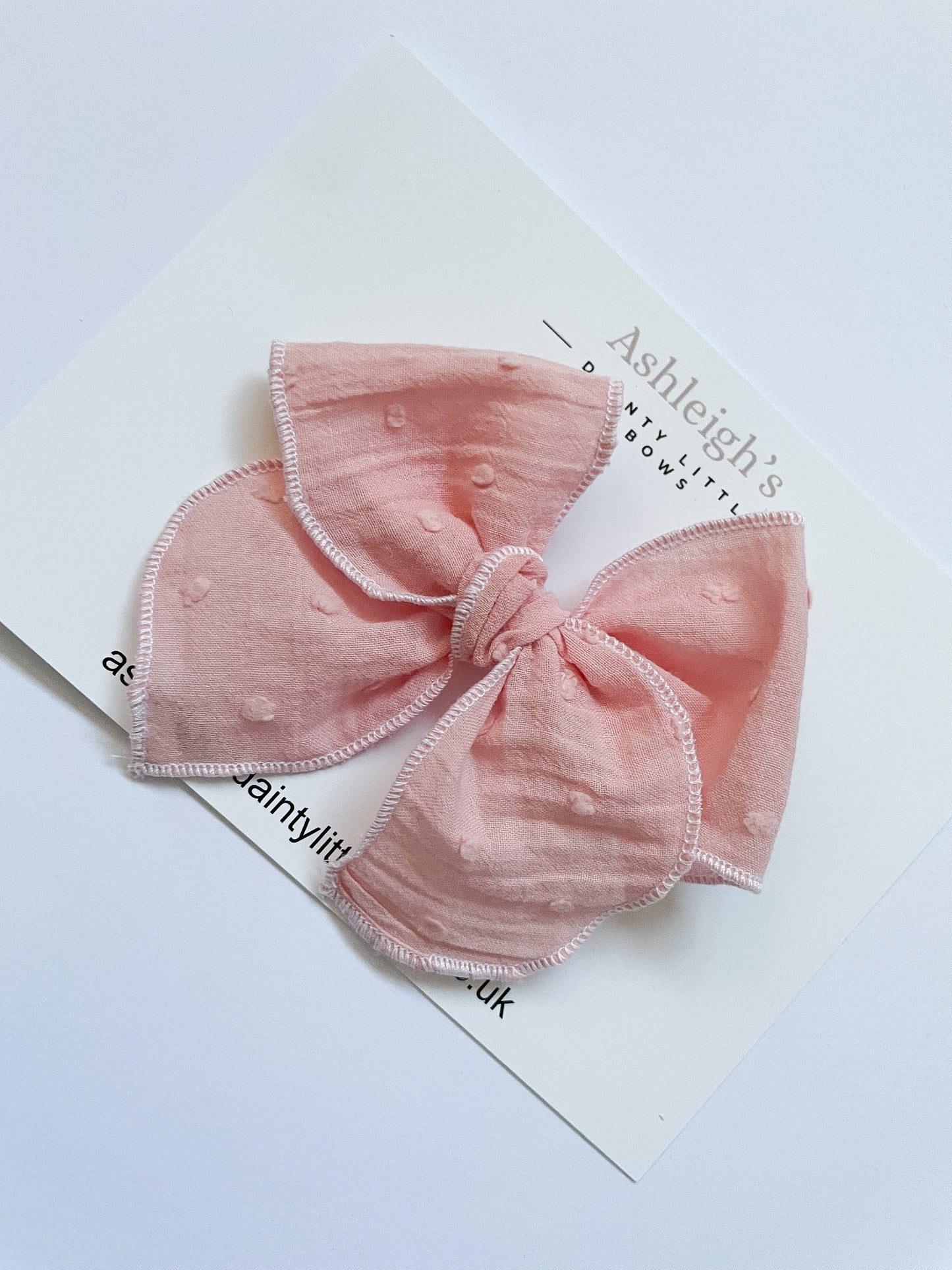 Pink dotty fable bow