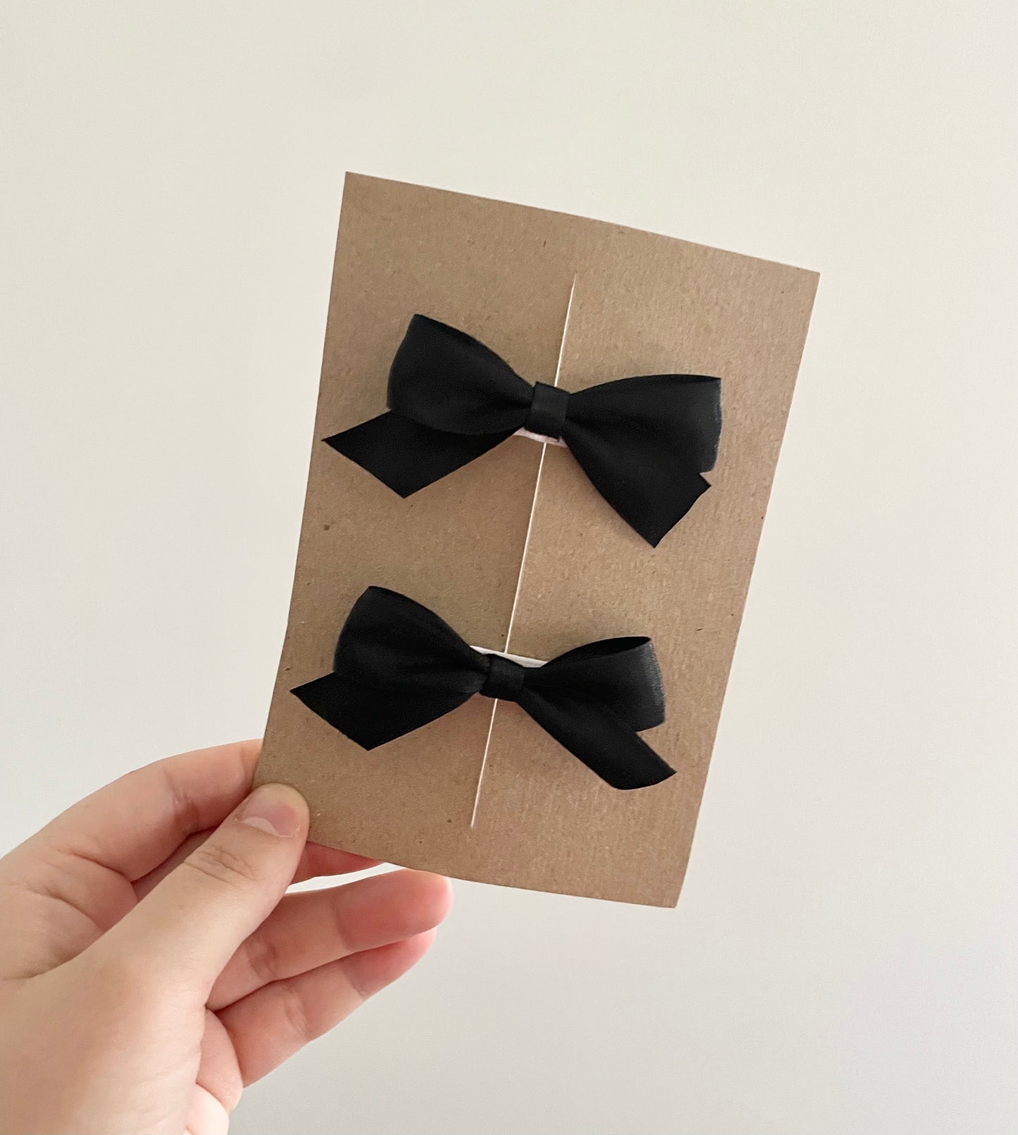 Black satin ribbon bow